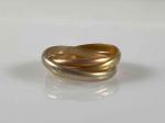 BAGUE "Trinité" composée de trois anneaux mobiles enlacés en or...