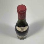 1 bouteille ALOXE CORTON - DARVIOT 1964 Etiquette légèrement tachée.